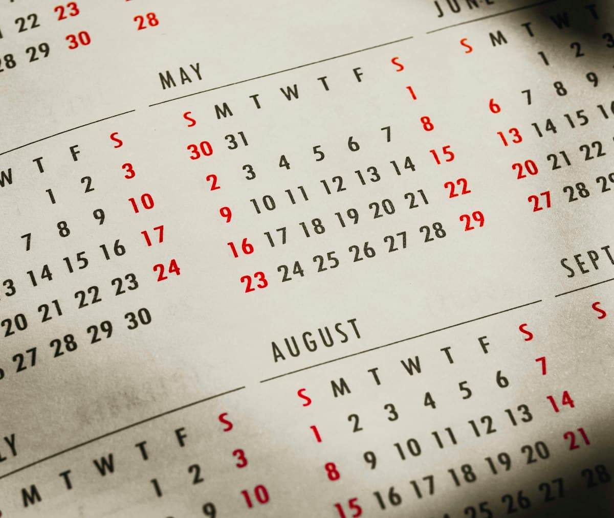 Close-up of a calendar on a table, useful for counting days between two dates
