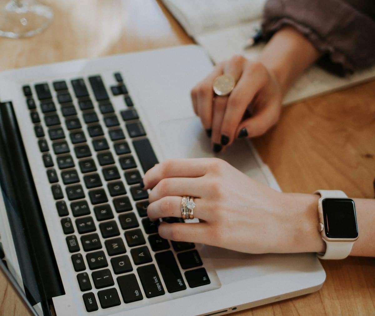 Person typing on a laptop while working on freelance projects from a flexible location