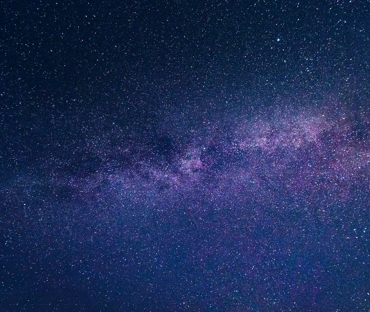 Milky Way stretching across a dark night sky full of stars