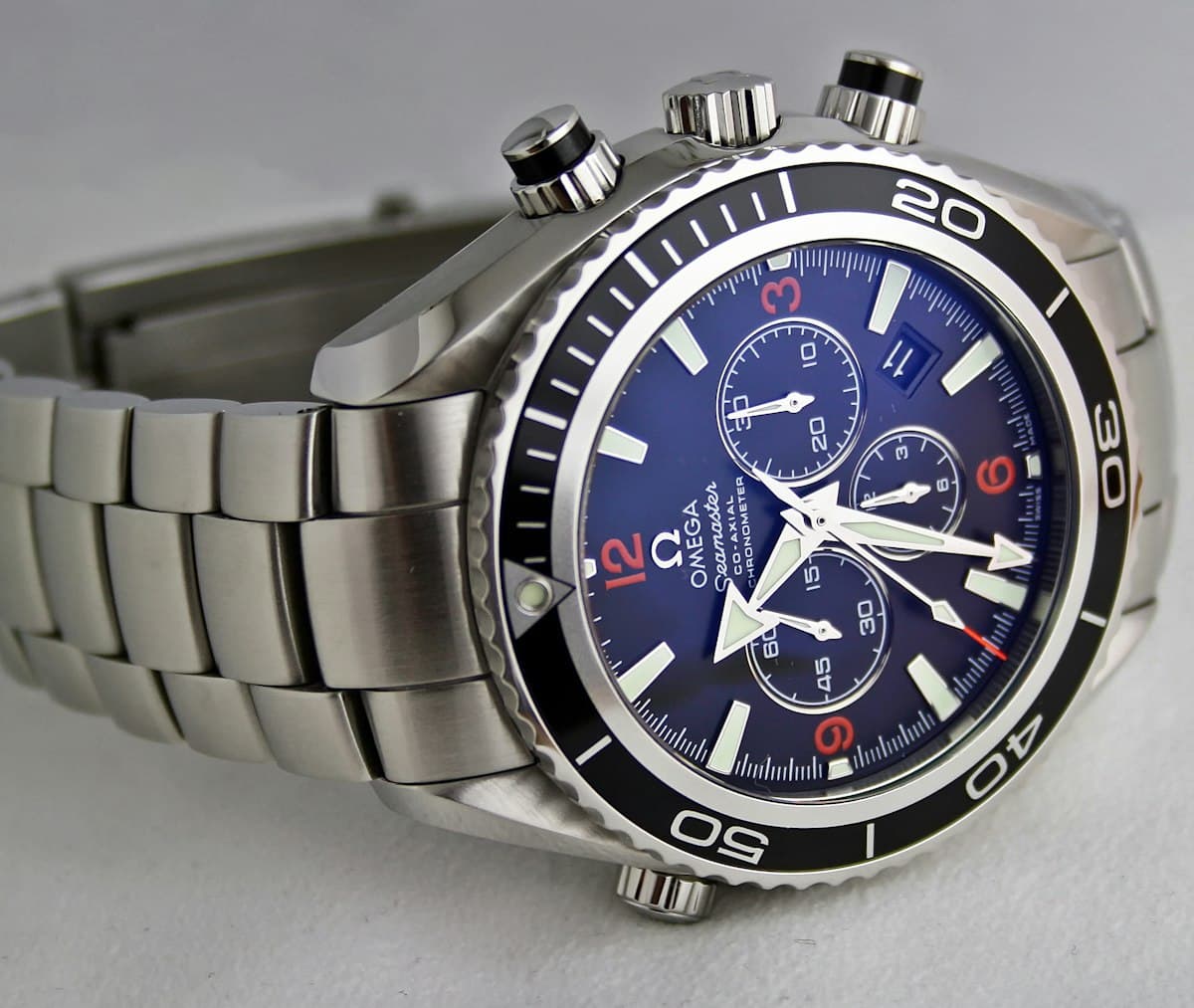 Close-up of an analog wristwatch face showing the time at 10:34 in the morning